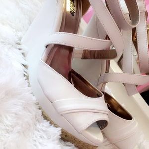 White high heeled wedges.